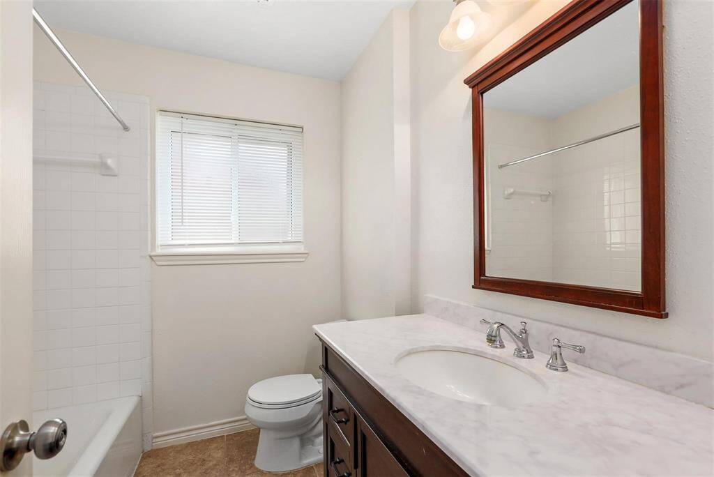 FULL hall bath conveniently located between both secondary bedrooms.
