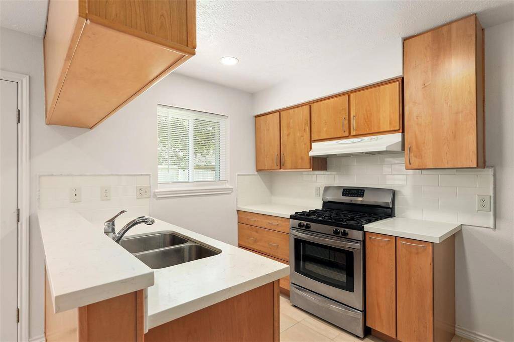 Kitchen included stainless steel appliances.