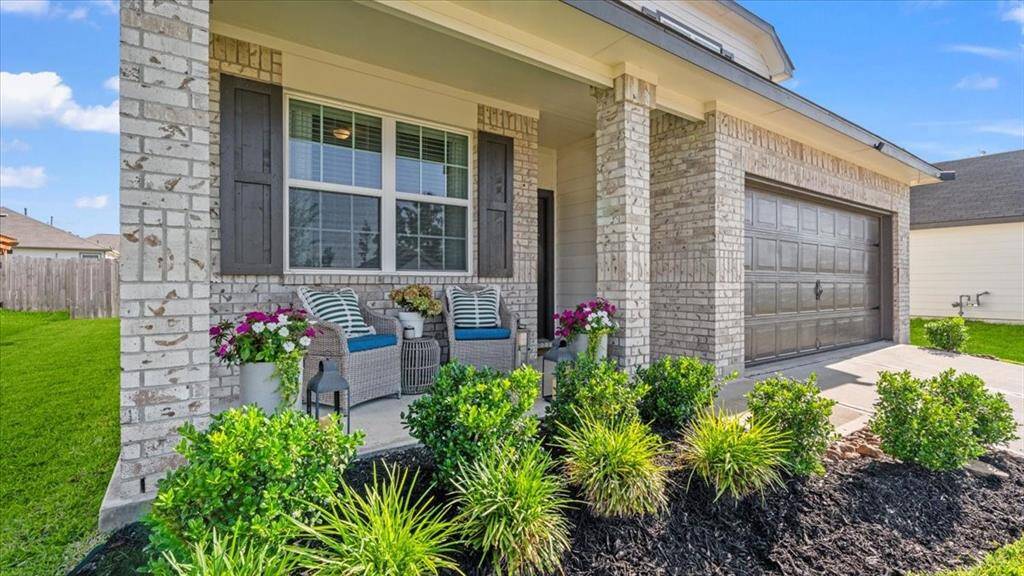 Inviting entry porch with established landscaping