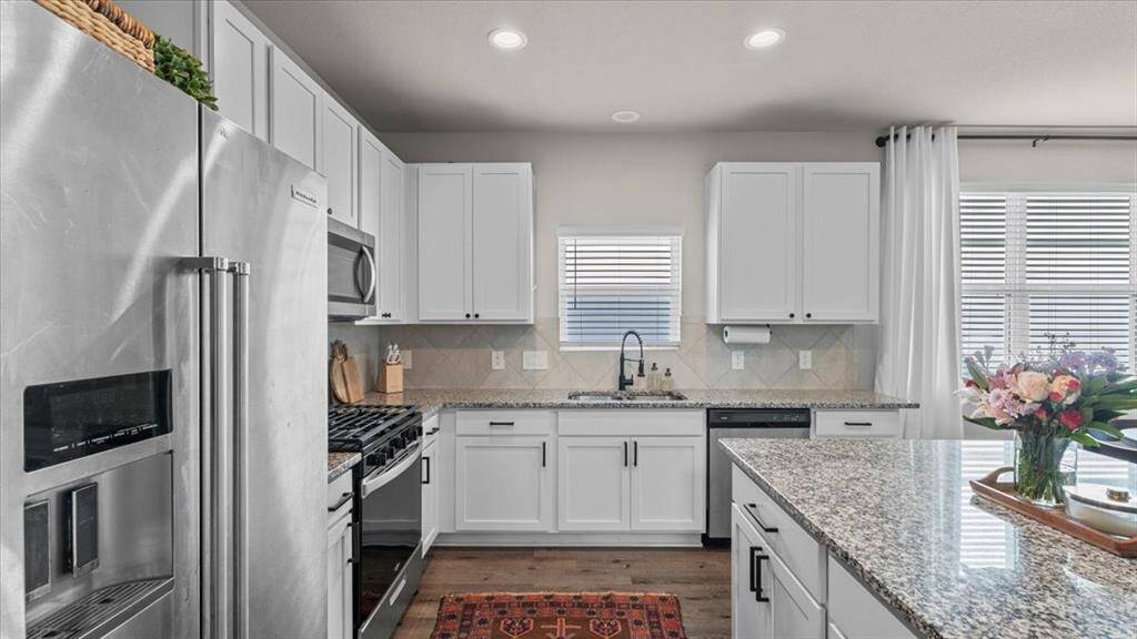 Bright kitchen with added cabinet handles and drawer pulls