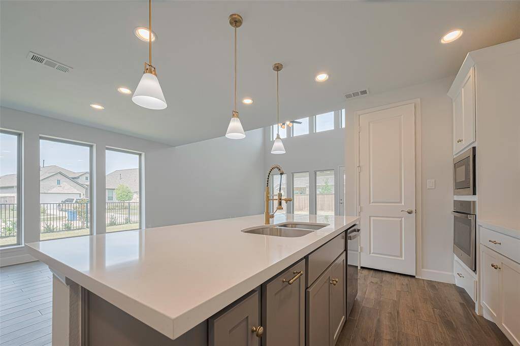 The kitchen open to the dining and living areas for open concept living and entertaining.