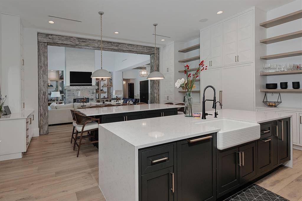 Paneled fridge and freezer in the kitchen, 2nd dishwasher, sink and fridge in the adjacent scullery.