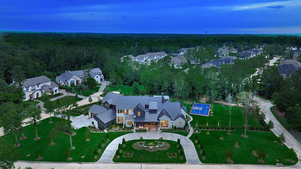 Located on over an acre in the exclusive gated neighborhood of Pine Island in Woodforest.