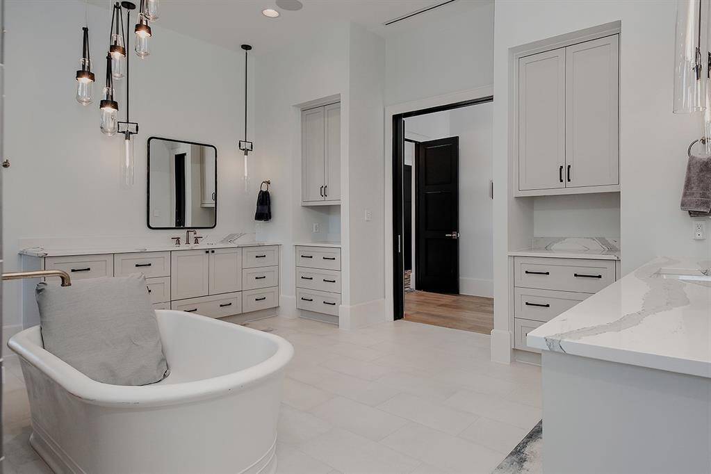 The attention to detail is meticulous, from the faucets and hardware to the counters, tile and lighting, creating a timeless spa-like environment.