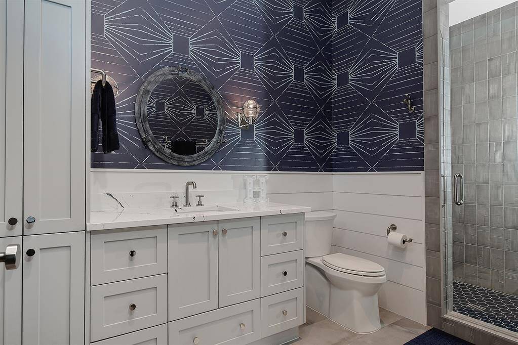 Guest bath upstairs with step in shower.