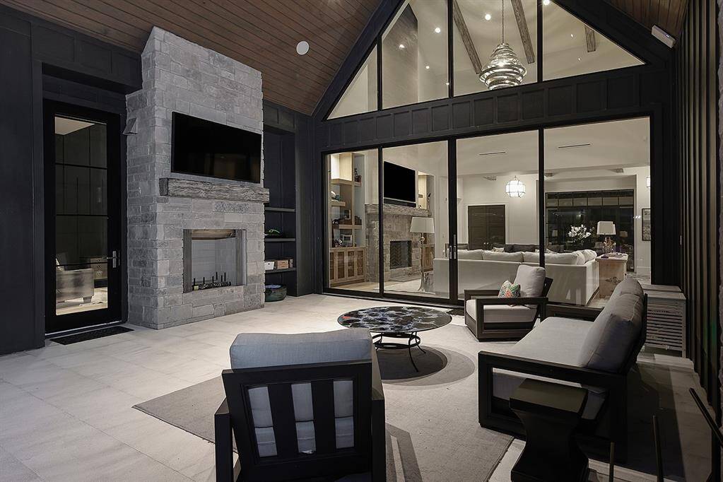 The outdoor fireplace in the covered patio is a great place to unwind.