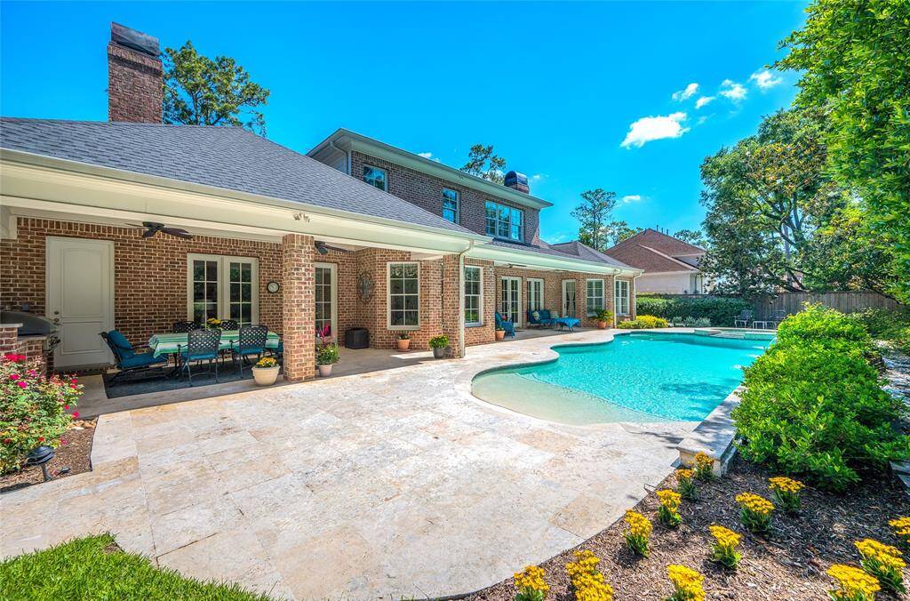 Entertainers paradise with 2 covered patios and a beautiful pool