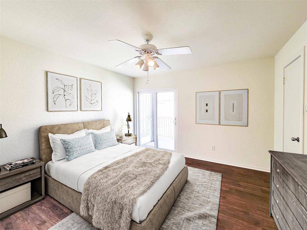 Generously proportioned secondary bedroom with wood-like laminate flooring, ceiling fan and double-paned sliding door with access to private balcony. Large walk in closet pictured on the right. (This photo is virutally staged.)