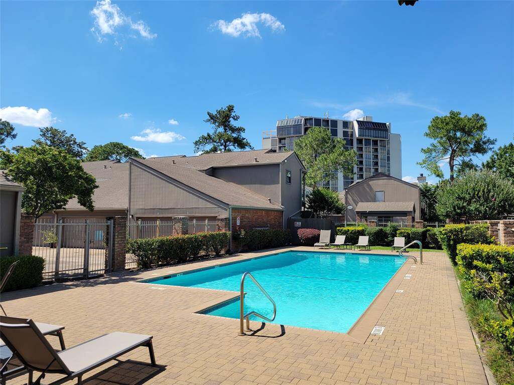 The inviting community pool is located just across the driveway from the building housing #44.