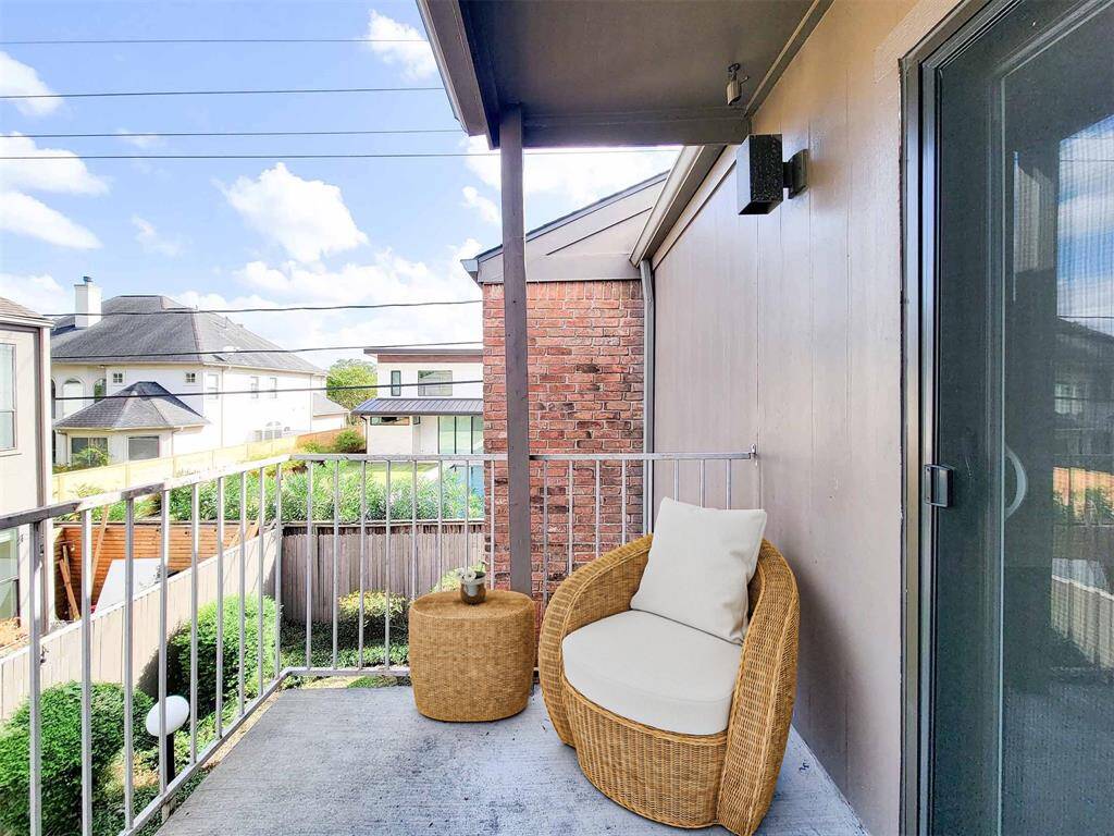 Private balcony can be accessed from the living room or secondary bedroom. Virtually staged photo.