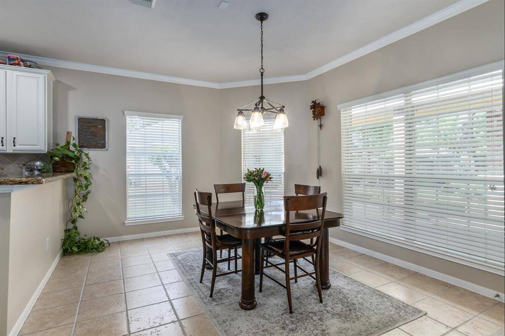 Here's the breakfast room. It overlooks the beautiful backyard too with LOTS of windows!