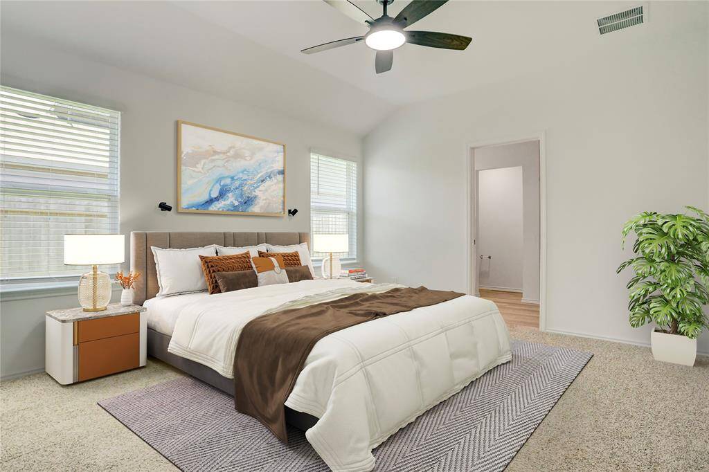 This virtually staged primary bedroom showcases its generous proportions, soft carpeting, and wide-set windows. A ceiling fan adds comfort while the neutral color scheme creates a restful space.