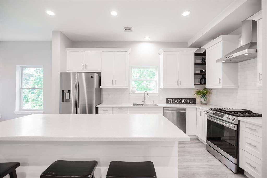 Beautiful kitchen with stainless steel appliances.