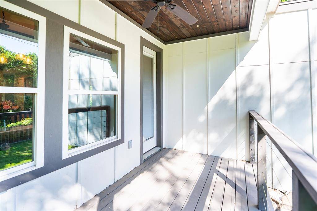 Deck outside of kitchen area showing door leading back into house.
