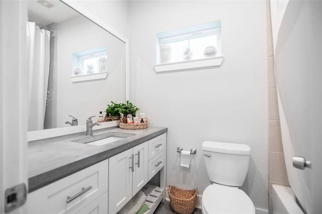 Upstairs full bath with tub and shower.
