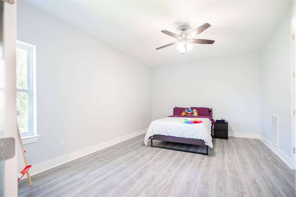 One of the two upstairs bedrooms on the second floor.