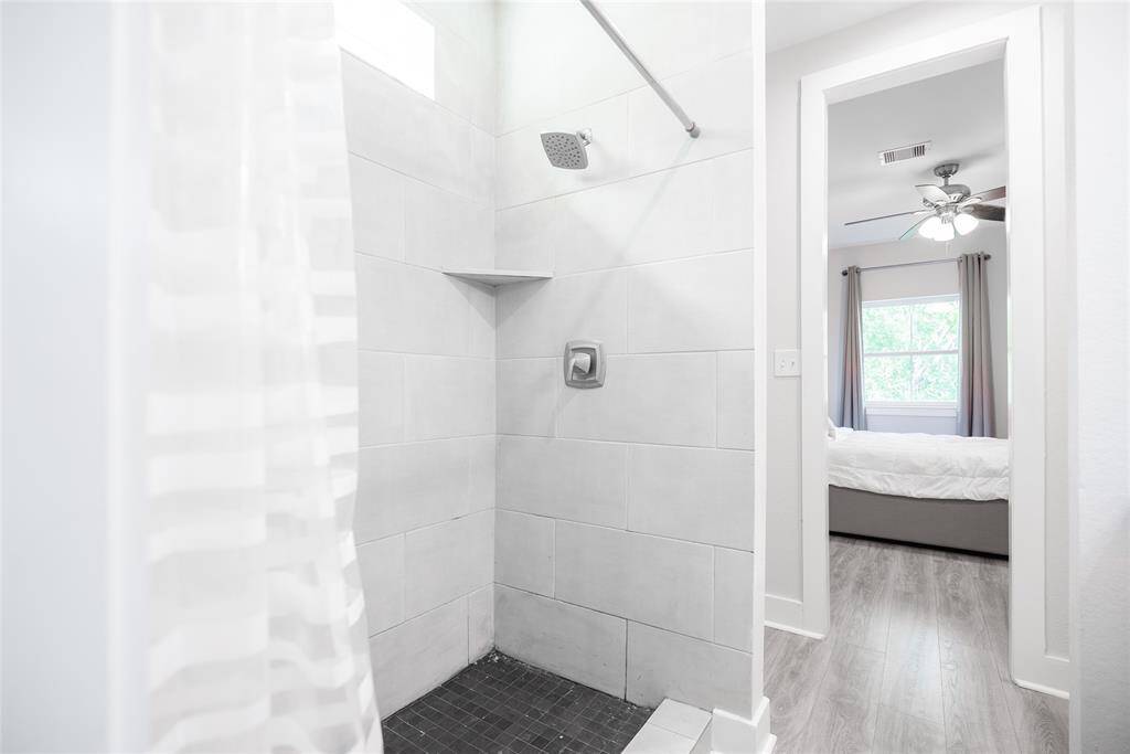 Second bedroom bathroom with a standing shower.