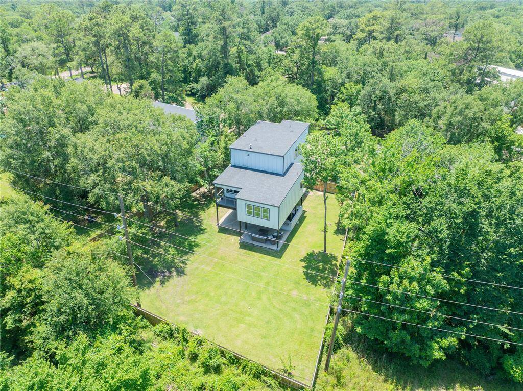 Aerial view of the back of the house and yard.