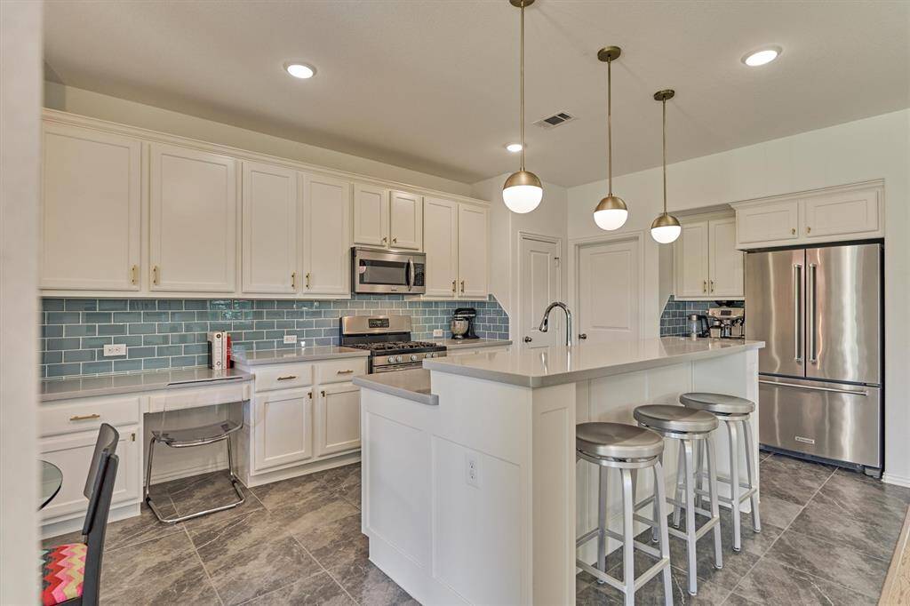 Bonus planning desk with additional cabinetry for storage is ideal!