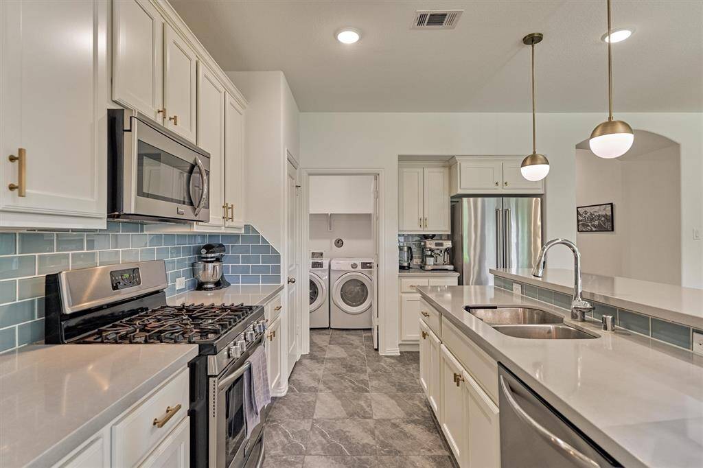 Utility room conveniently located off the kitchen.