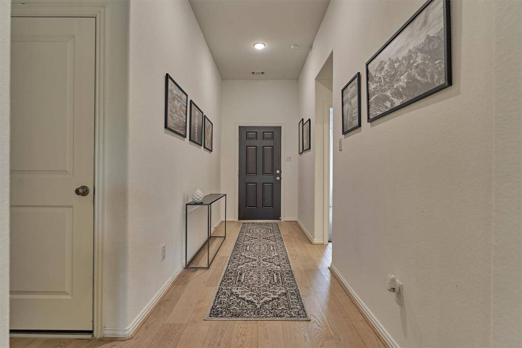 Split floor plan features 2 secondary bedrooms at the front of the home. Note - easy access to the garage from the main hallway.