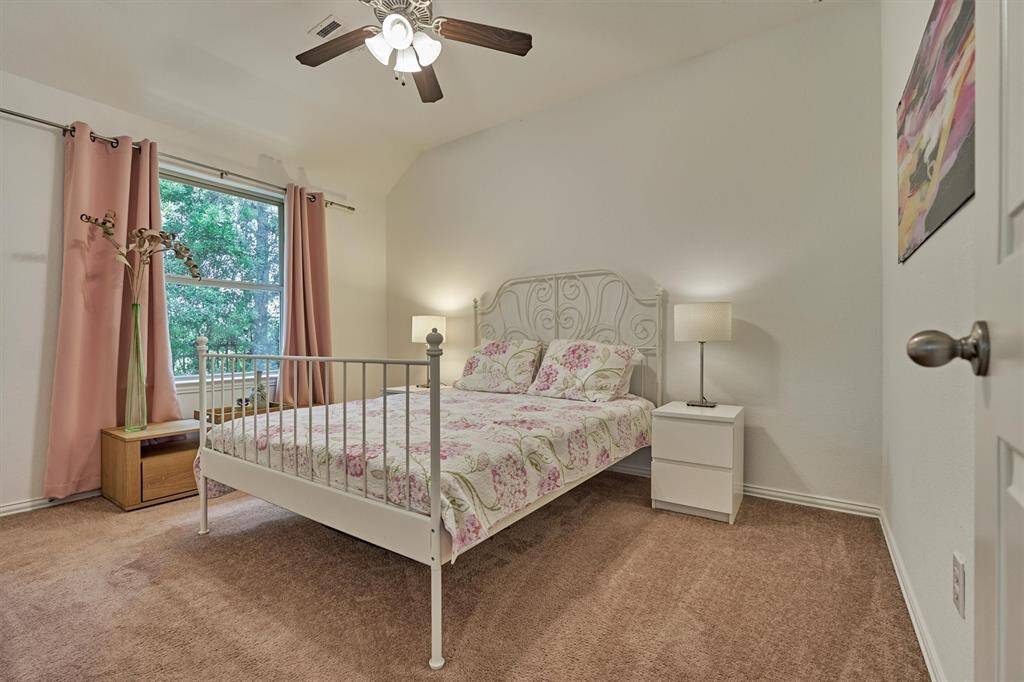 Serene views from this restful guest bedroom at the front of the home.