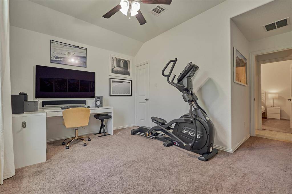 Secondary bedroom at the front of the home could easily be used as a home office or gym.