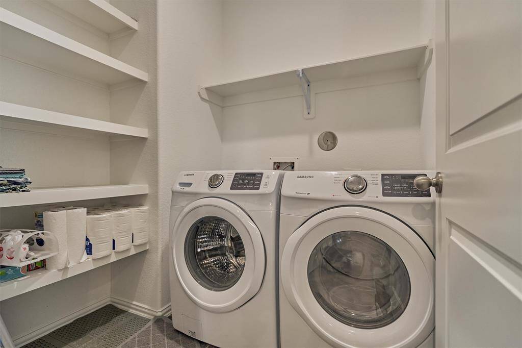 Utility room with max storage options is ideally situated off the kitchen.