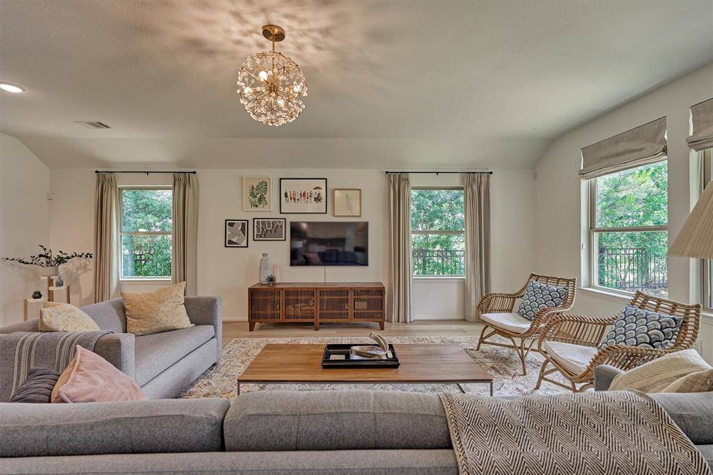 Impressive greenbelt views accentuate this expansive family room.