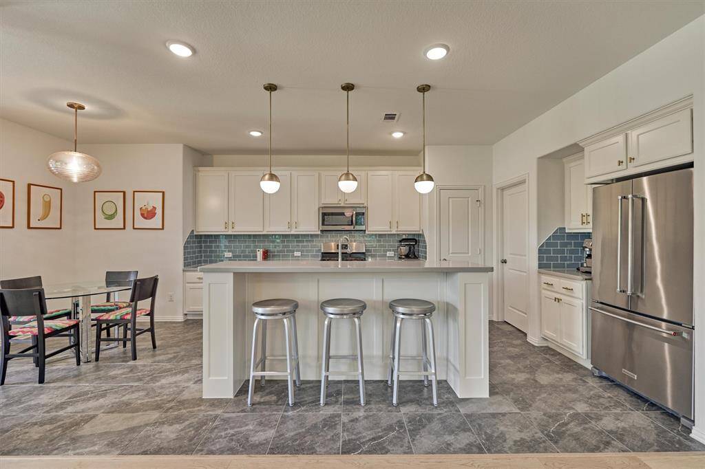 Wow! Chef's kitchen is the heart of the home!  Luxe finishes and upgraded fixtures highlight this space!