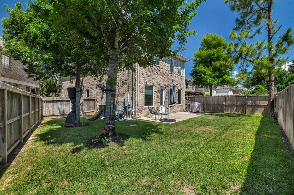 Backyard is completely fenced.
