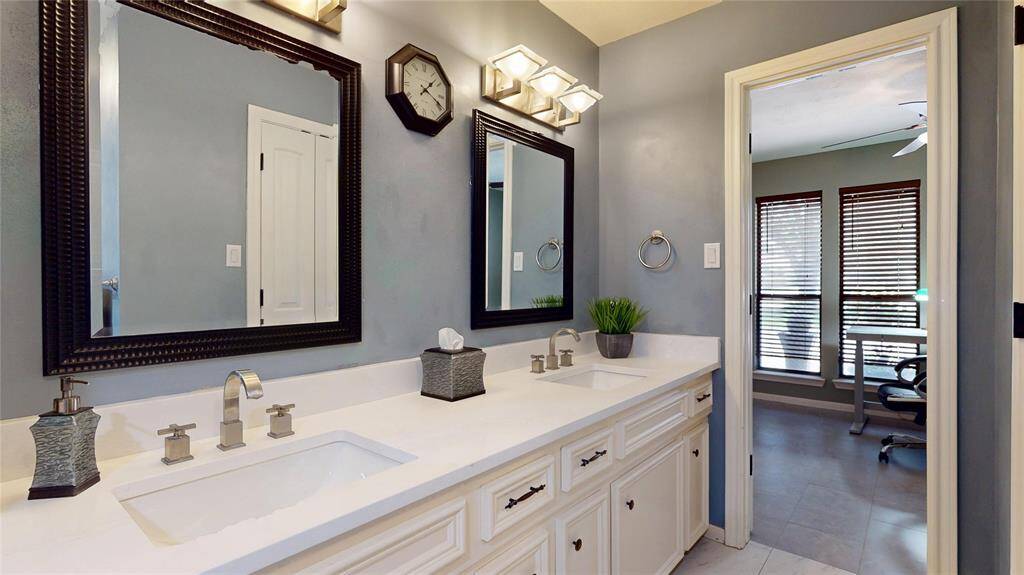 Spacious dual-sink vanity perfect for a seamless morning routine.