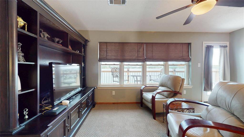 Upstairs game room with expansive balcony access.