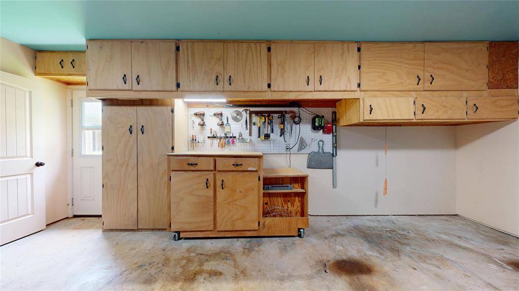 Expansive garage with ample storage solutions.