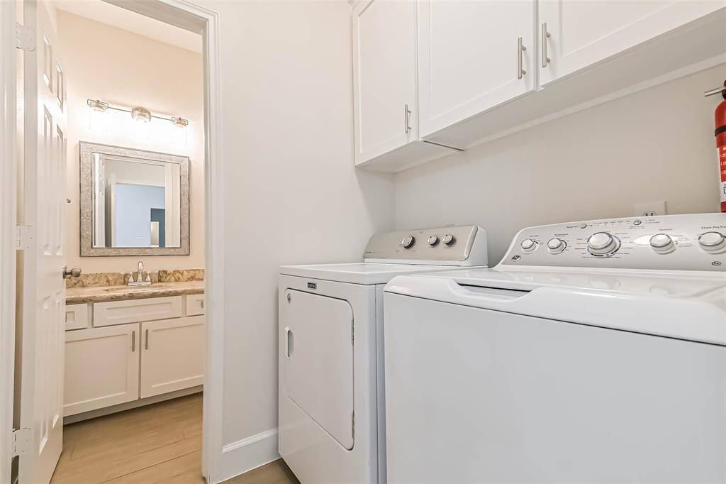 The utility room accommodates a full size washer and dryer. The cabinet faces in this room have also been updated.