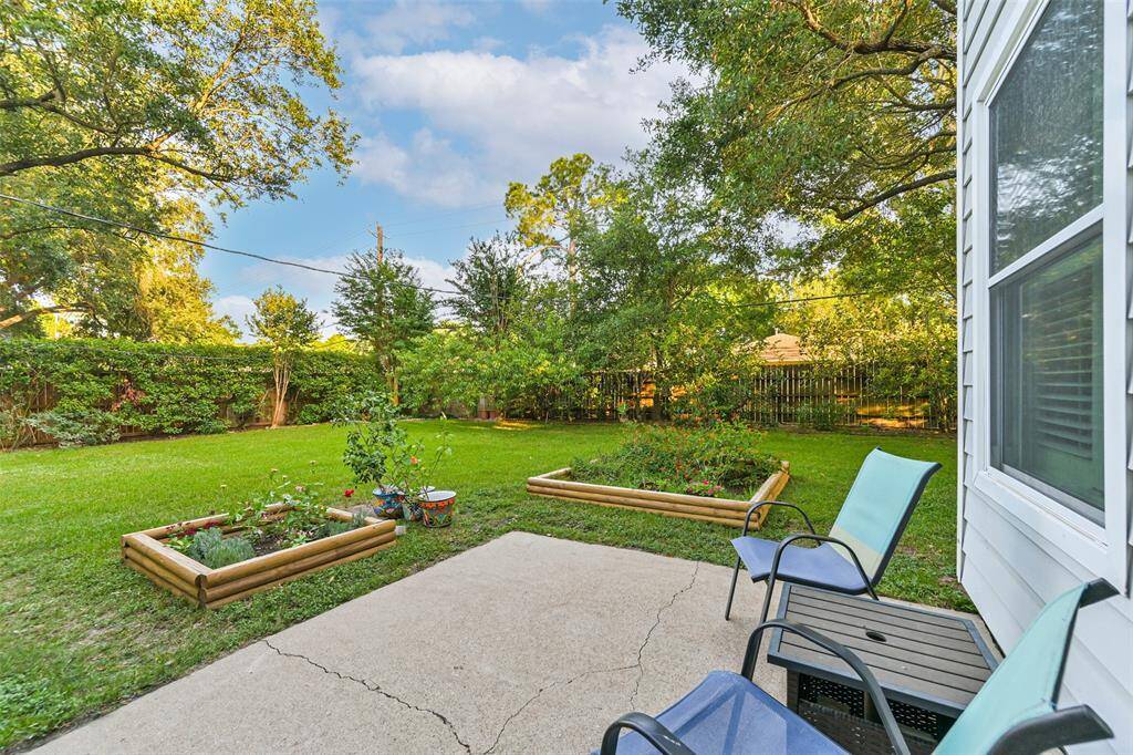 Out back is a private patio and planter boxes to grow your favorite veggies or herbs.