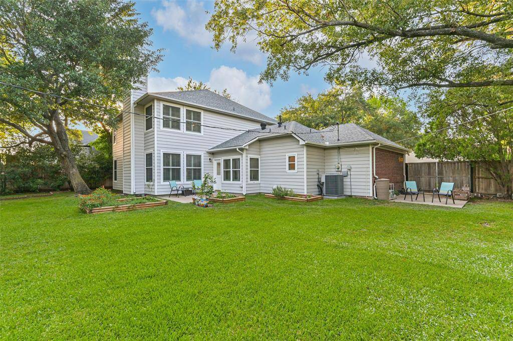 This beautiful home expands over two lots.