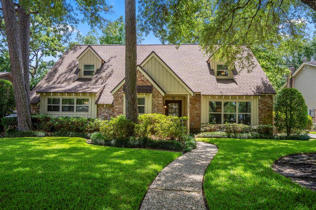 Welcome home! Fantastic curb appeal with mature trees, manicured landscaping, and a charming façade that sets the tone for what’s inside.