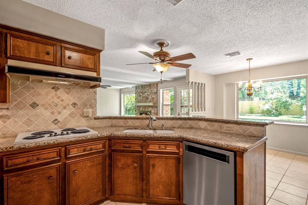 Well-designed kitchen with granite counters, double oven, and lots of storage—plus an open layout that connects to the family room and eat-in nook.
