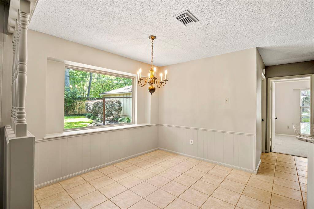Cozy eat-in kitchen area with a large window that brings in tons of natural light—perfect spot for your morning coffee.