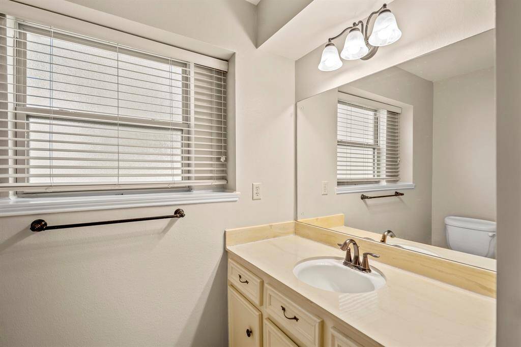 Enjoy a functional layout in the primary bath with a tub/shower combo, built-in shelving, and dual vanity access.