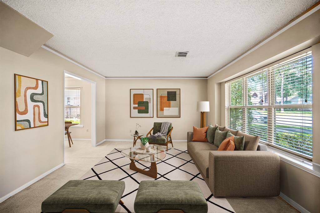 Spacious and light-filled formal living room—perfect for relaxing or spending time with family. - VIRUALLY STAGED