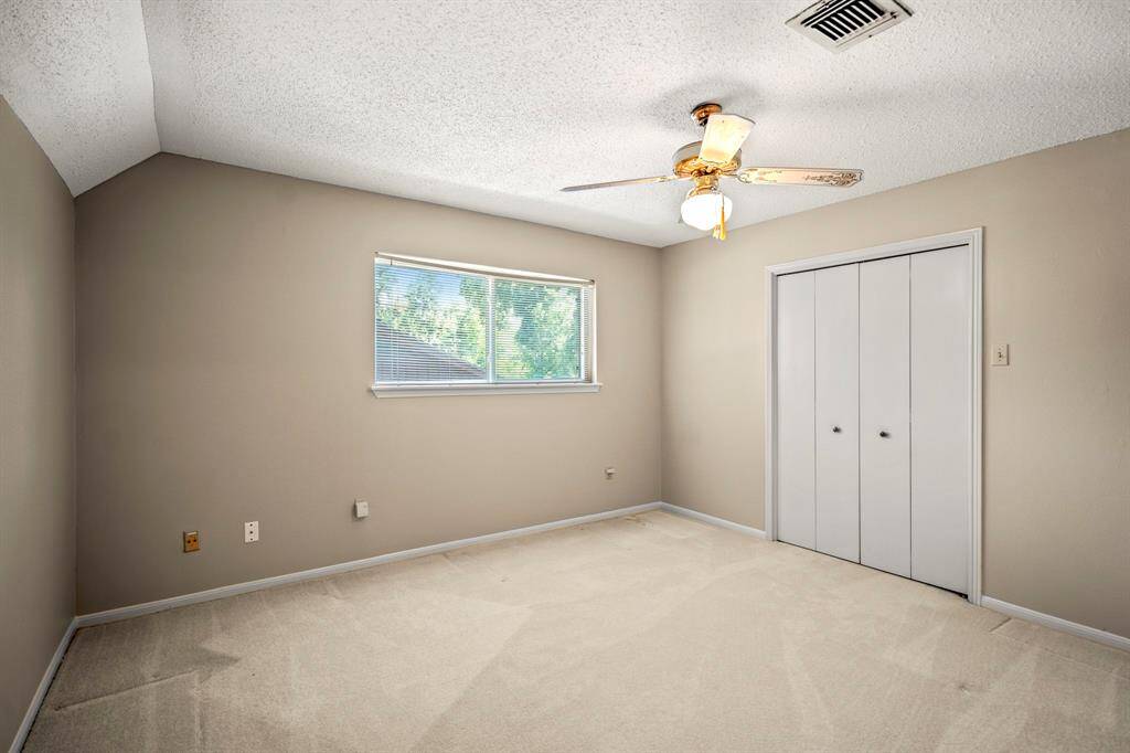 Located on the second floor, Bedroom #4 offers great space, a walk-in closet, and a built-in desk that adds a touch of personality.