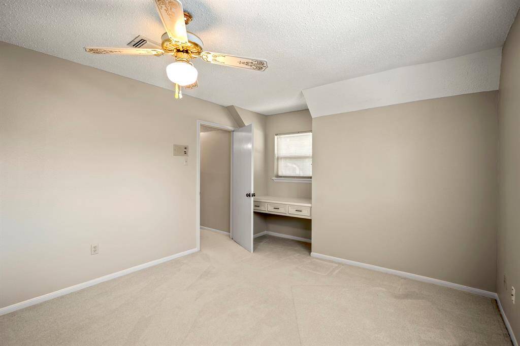 Located on the second floor, Bedroom #4 offers great space, a walk-in closet, and a built-in desk that adds a touch of personality.
