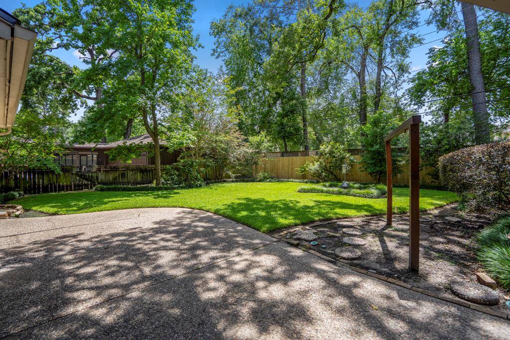 Step into your own private escape with mature trees, manicured landscaping, an 8-foot privacy fence, and a full-yard sprinkler system to keep things green and gorgeous.