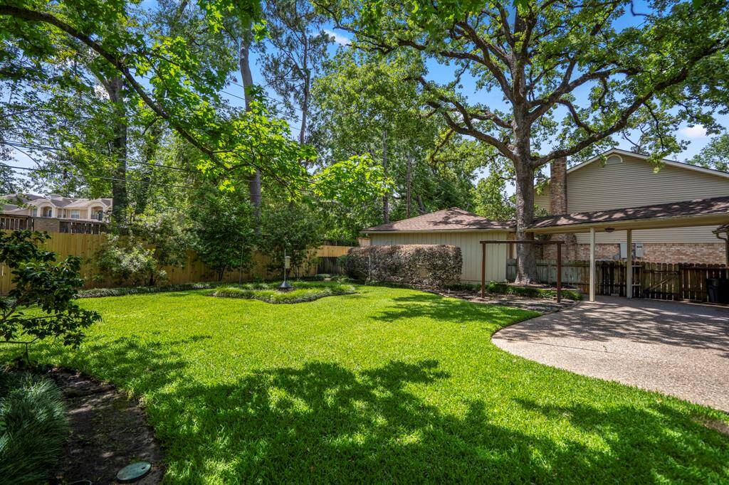 Step into your own private escape with mature trees, manicured landscaping, an 8-foot privacy fence, and a full-yard sprinkler system to keep things green and gorgeous.