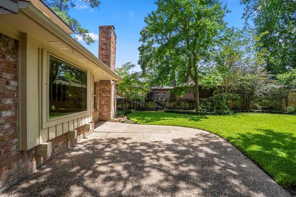 Step into your own private escape with mature trees, manicured landscaping, an 8-foot privacy fence, and a full-yard sprinkler system to keep things green and gorgeous.