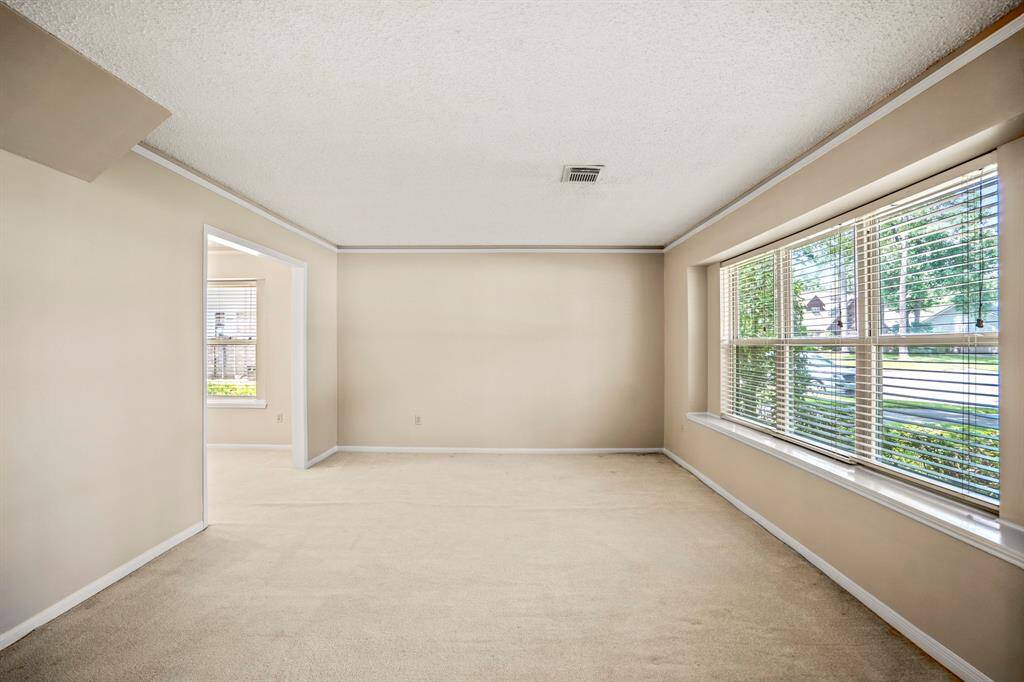 Spacious and light-filled formal living room—perfect for relaxing or spending time with family.