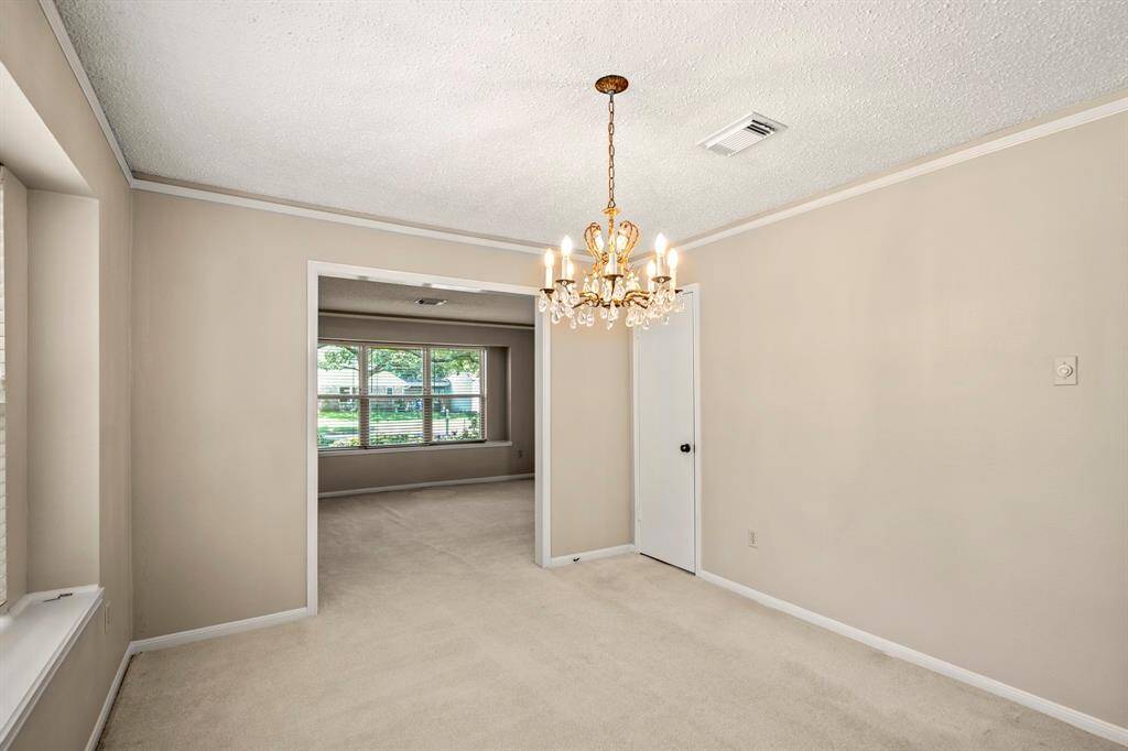 Bright and open dining space with large windows and a convenient flow right into the kitchen.
