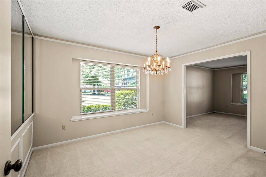 Bright and open dining space with large windows and a convenient flow right into the kitchen.
